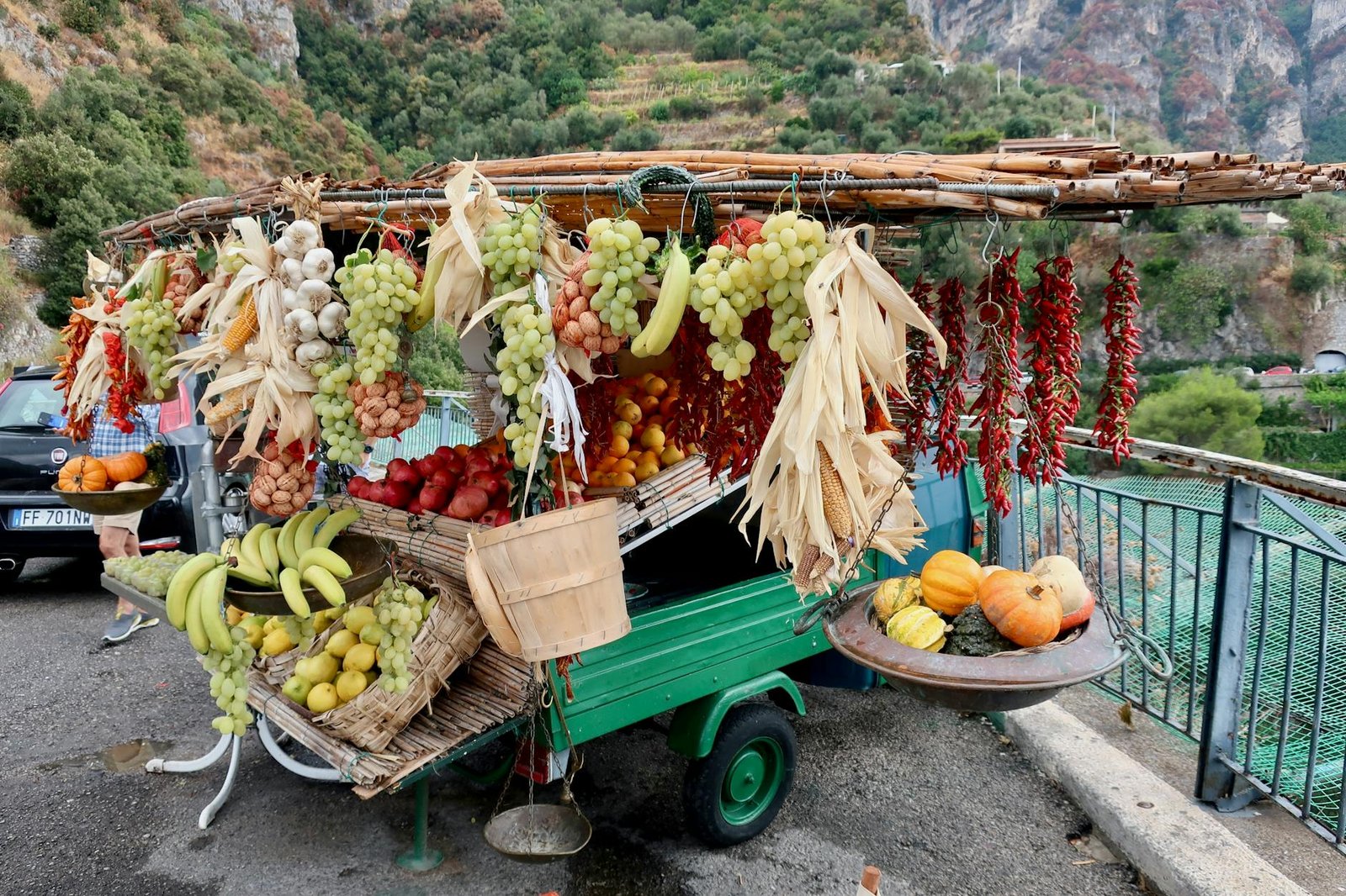 Colorful market stall with fresh fruits and vegetables on Amalfi coast, Italy.