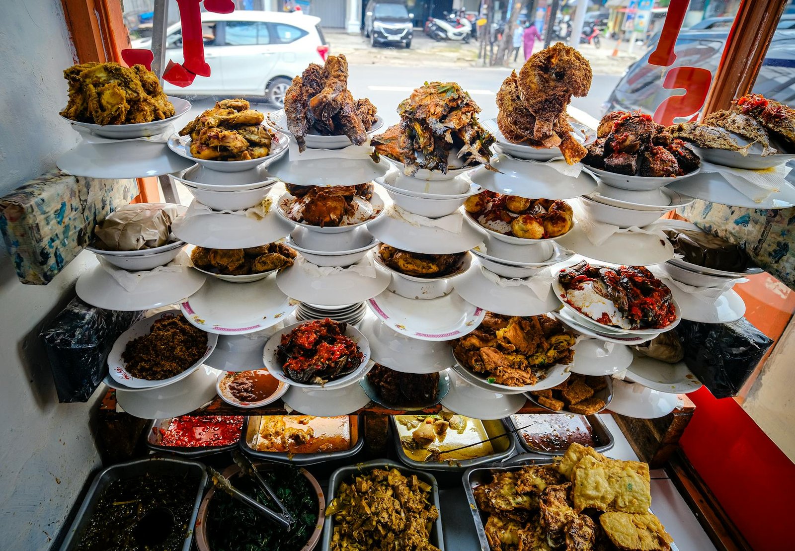 Indonesian culinary display in Jakarta showcasing traditional and spicy dishes in a vibrant setting.
