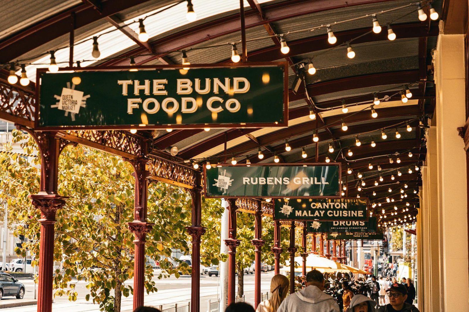 Charming view of Queen Victoria Market with illuminated signs in Melbourne, Australia.