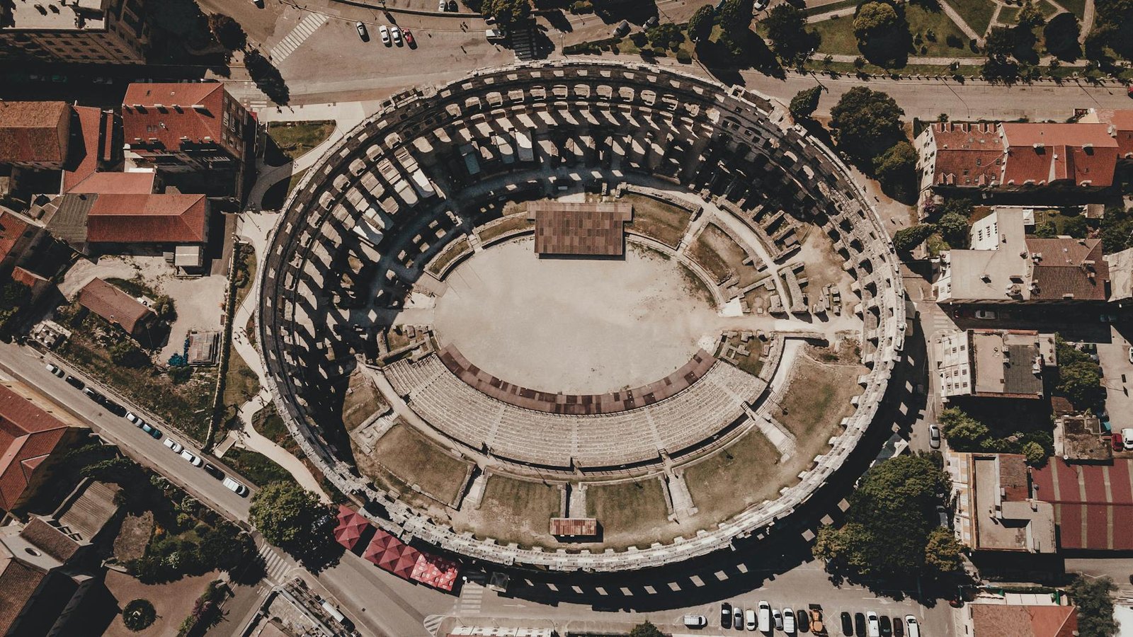 Stunning aerial shot of the ancient Roman Pula Arena in Croatia showcasing epic architecture.