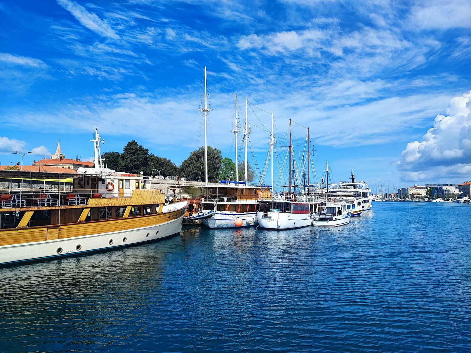 A picturesque view of sailboats docked in the tranquil harbor of Zadar, Croatia.