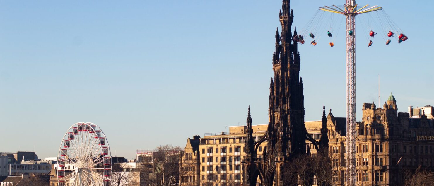 Scott Monument and a Ferris wheel in Edinburgh in winter
