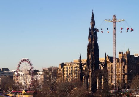 Scott Monument and a Ferris wheel in Edinburgh in winter