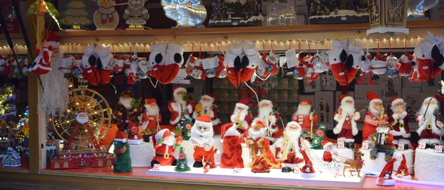 Christmas market stall with Santa Claus figures in Strasbourg