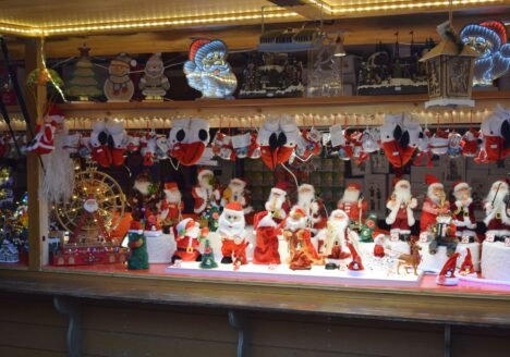 Christmas market stall with Santa Claus figures in Strasbourg