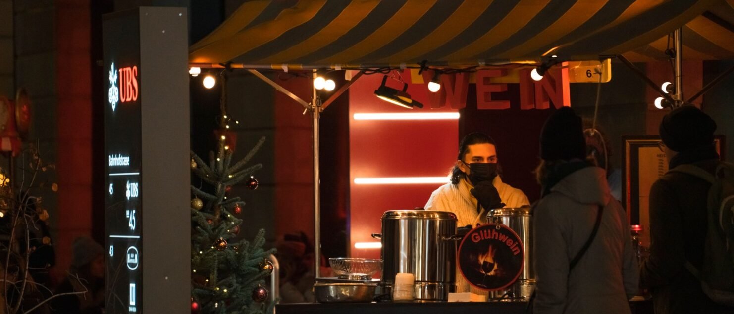 Mulled wine stall at a Christmas market at night