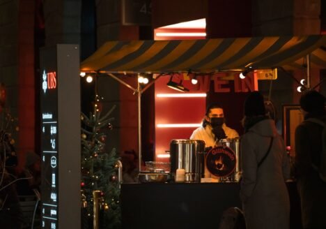 Mulled wine stall at a Christmas market at night
